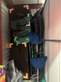 large leather sectional and two blue barstools