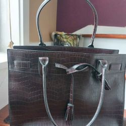 large tote handbag featuring a burgundy/maroon crocodile-embossed finish.