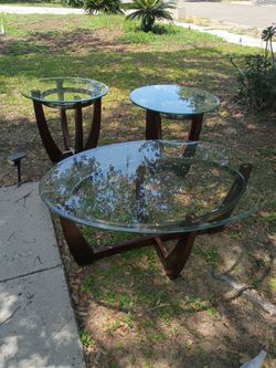Two beveled glass end tables one bevel glass coffee table