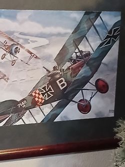 Framed German Fokker Triplane in a dogfight with a British fighter