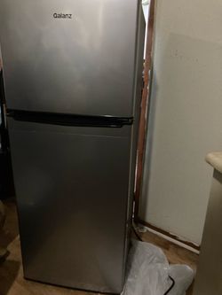 Small Mini Refrigerator freezer top stands 4 feet tall