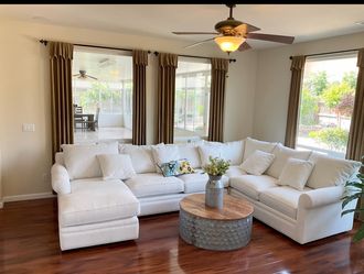 Curtains ($25) or Macy’s corner chair ($500) or end piece (RAF) ($700)