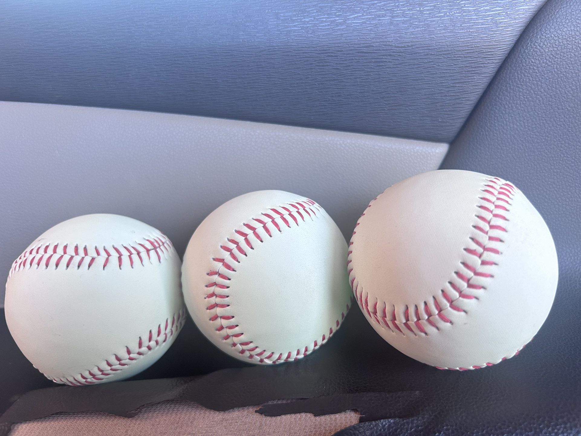 Three baseball balls