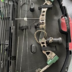 Bear compound bow, arrows and target
