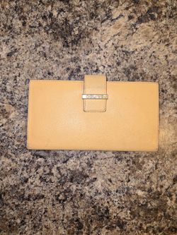 Celine tan/yellow leather wallet with lots of use