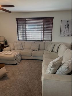 Ashley Furniture Beige L-Shaped Sectional Sofa with Chaise