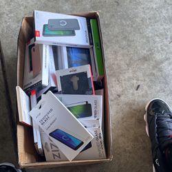 Box Full Of Screen Protectors And Cases