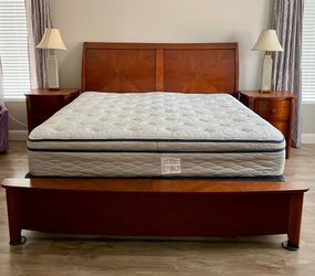 King size bed frame with headboard, footboard and mattress.