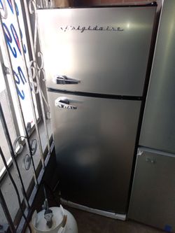 New Frigidaire stainless steel top and bottom refrigerator