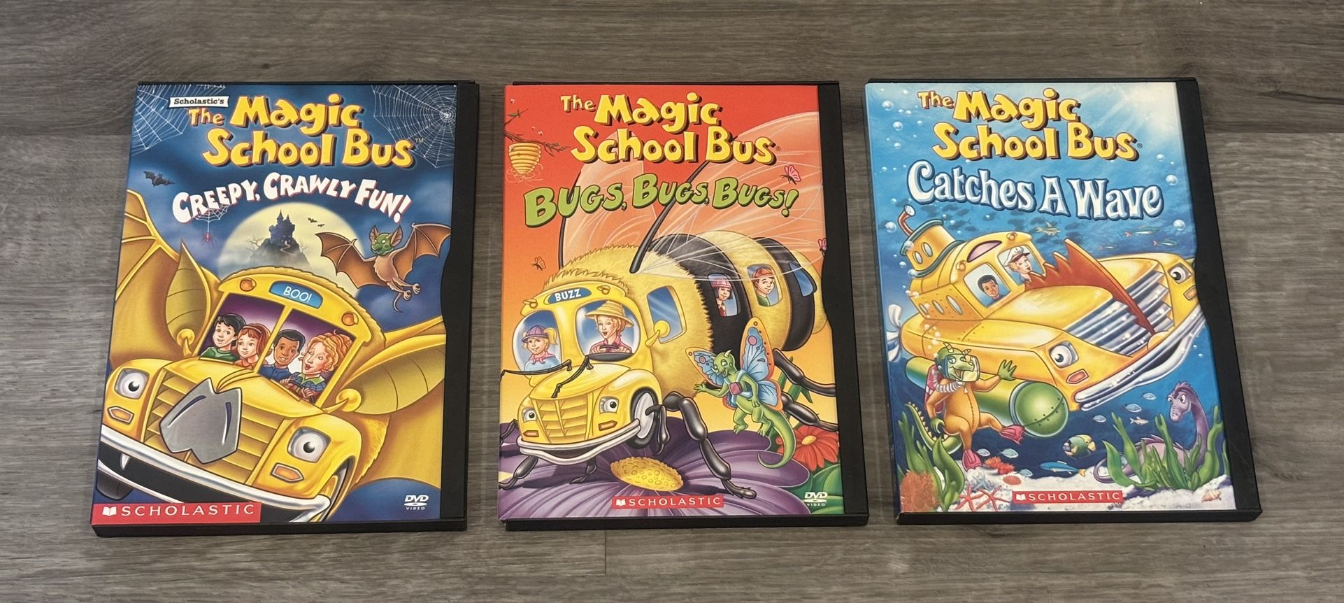 3 Magic School Bus DVDs: Creepy Crawly Fun!, Bugs, Bugs, Bugs!, and Catches A Wave.
