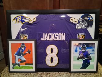 LAMAR JACKSON OF THE BALTIMORE RAVENS CUSTOM STITCHED, AUTHENTIC,BRANDED FRAMED JERSEY.