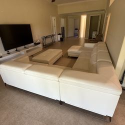 Leather sectional couch with ottoman