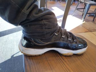 Air Jordan 11 Retro Black Patent Leather Sneakers