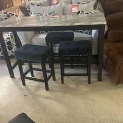 Hi table in three stools $450 brand new ready to go hurry