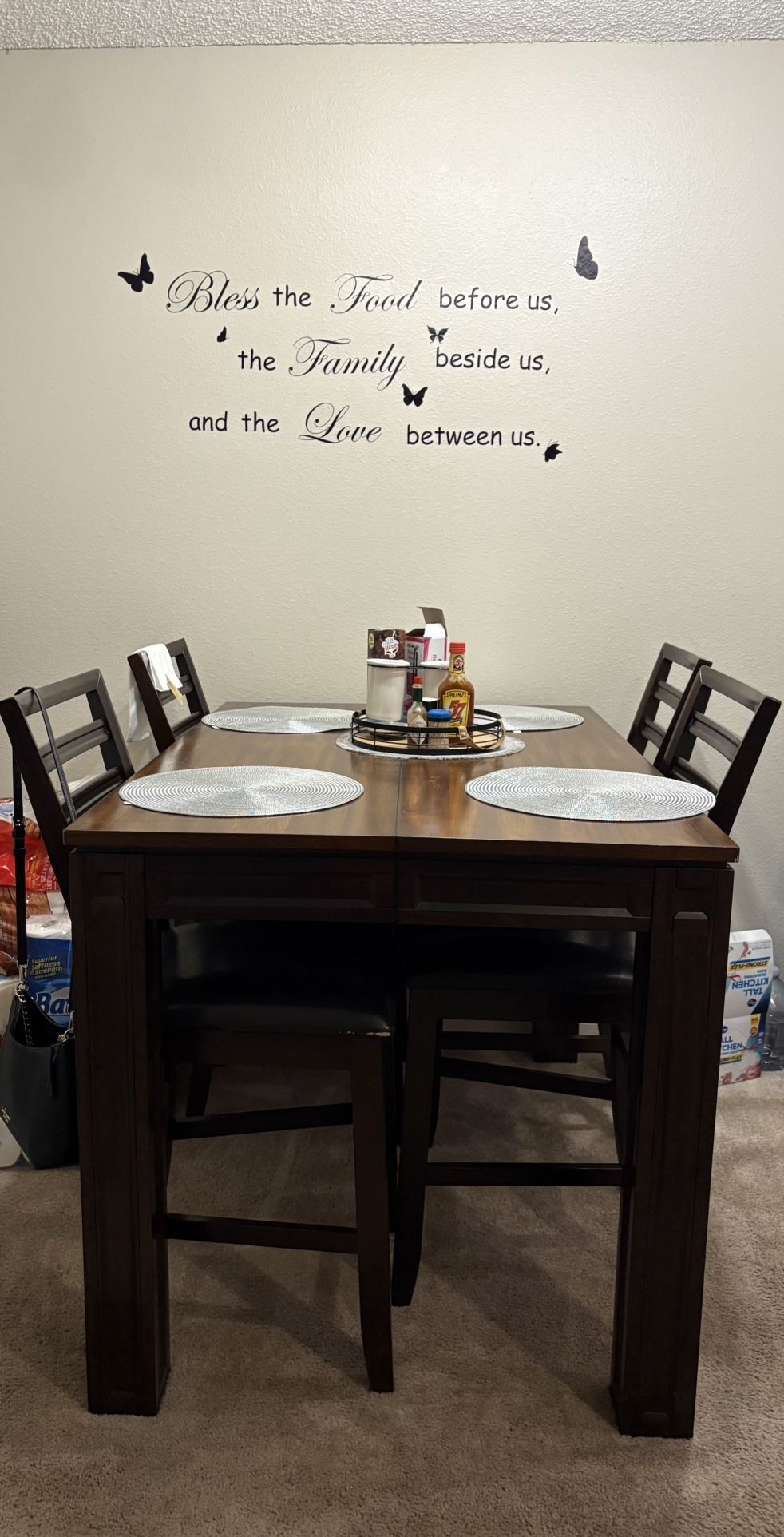High Dark Wood Dinning Table With Four Chairs And Grey Sectional Sofa With Chaise