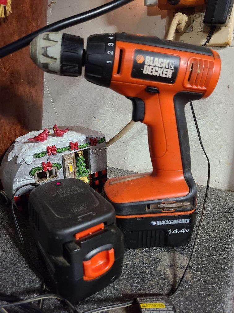Black and decker drill, batteries and charging station.