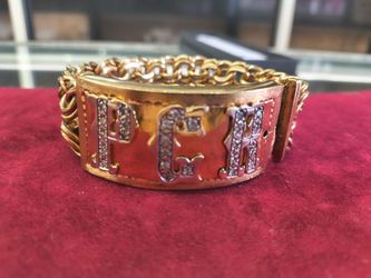 14k solid gold I'd breaclte with diamond on it layaway available 10% down if you interested please make sure you ask for Maribel thank you