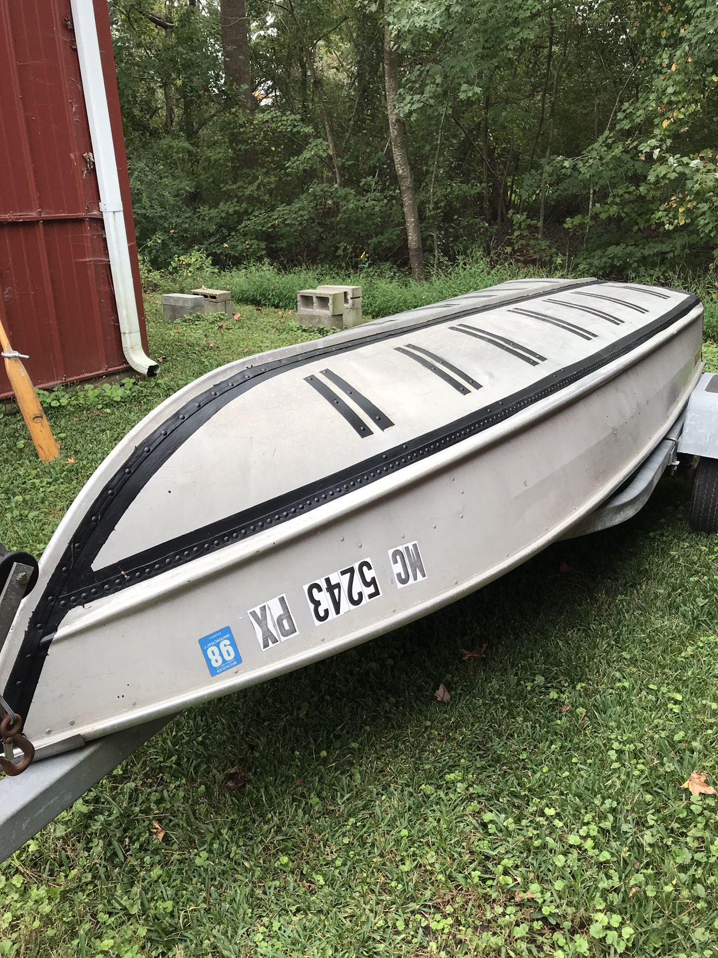 12 ft. “V” aluminum boat with two oars