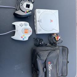 Original Dreamcast with cables and carry bag