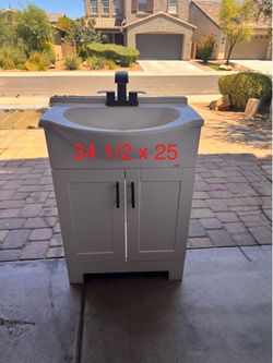 Bathroom sink and cabinet