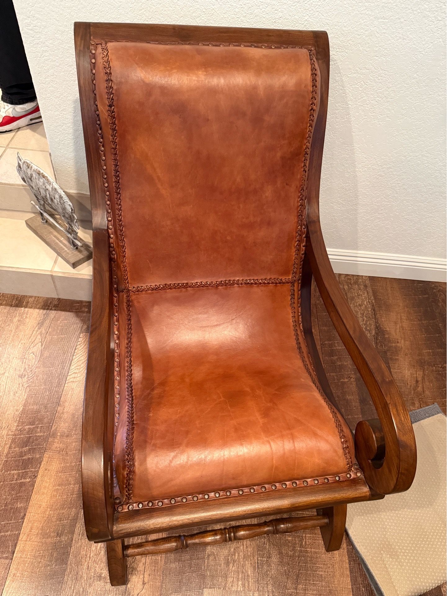 2 leather chairs with pillows