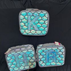 NEW JUSTICE  LUNCH BOXS  $7 EACH  THOSE LETTERS  ONLY I HAVE 