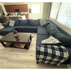 Sectional blue sofa and carpet