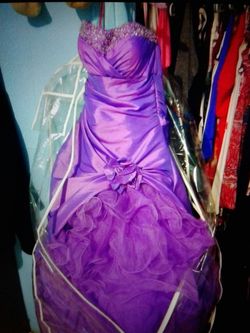 Sweetheart strapless shiny purple dress made by Maggie ceretto famous wedding dress maker
