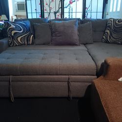 Small Grey Sectional With Storage And Turns Into Bed