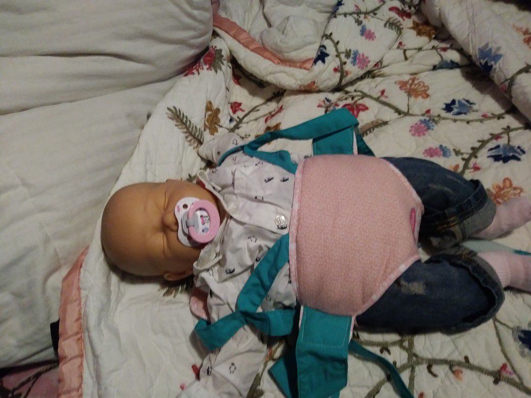 Newborn baby doll with carrier