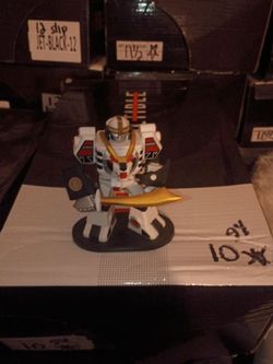 White Robot Warrior Collectible Figure with Sword