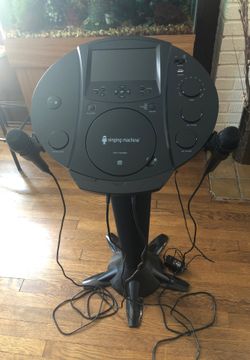 Karaoke singing machine like new with the extra microphone