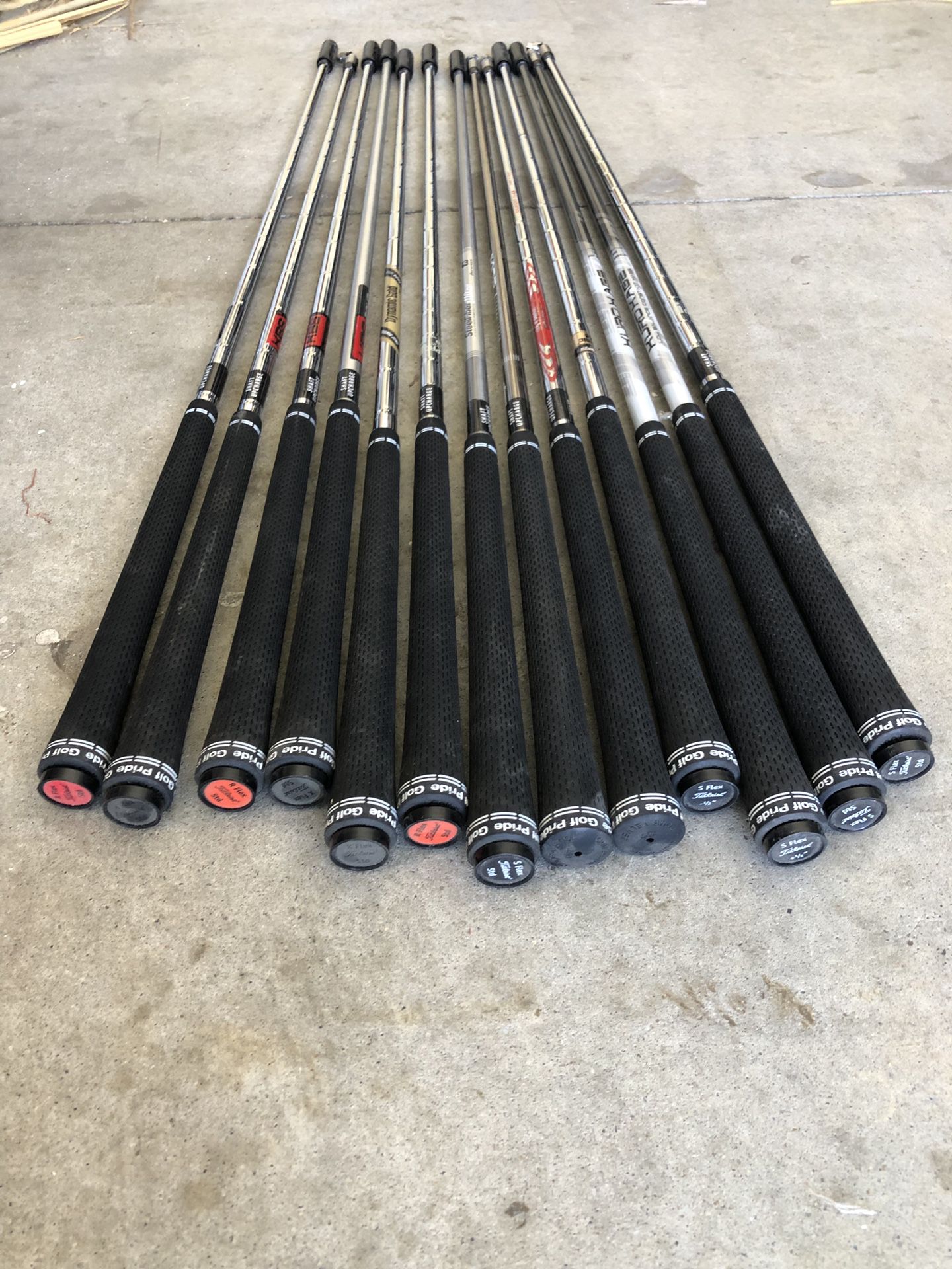 Various Golf club shafts with grips all new