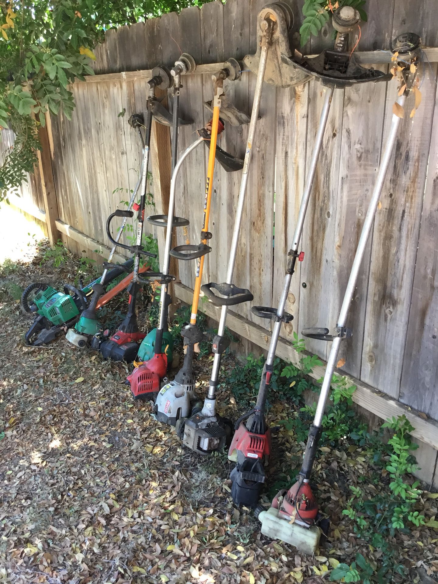 8 grass trimmers + 1 leaf blower