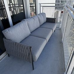Outdoor sofa with cover and side table