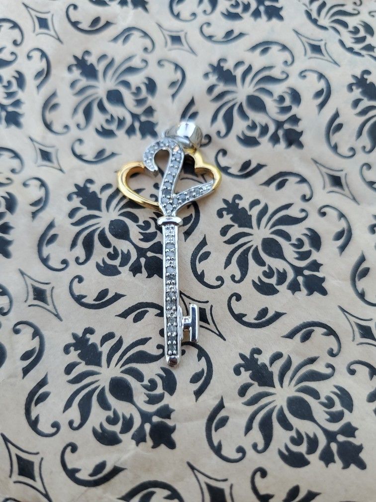 Real Diamond, Sterling Silver Key Pendant. 