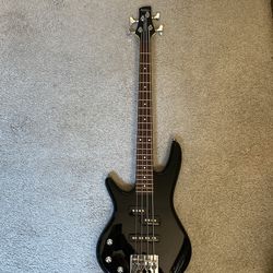Left-handed Ibanez Mikro bass.  Trade for a 6 string electric or acoustic guitar