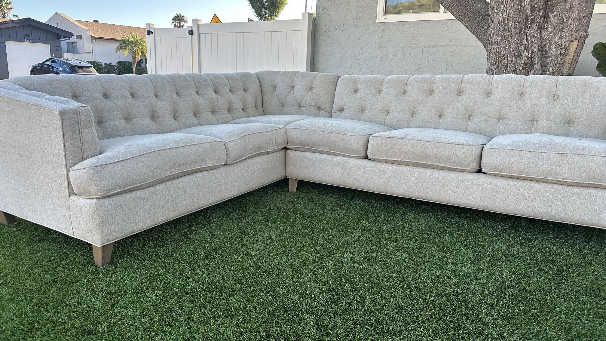 Beautiful L-shaped sectional sofa / couch Beige…