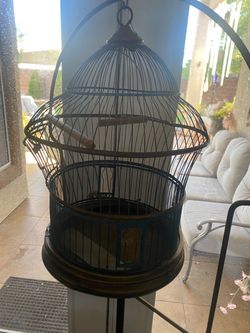 vintage metal hanging birdcage with a tall hoop floor stand