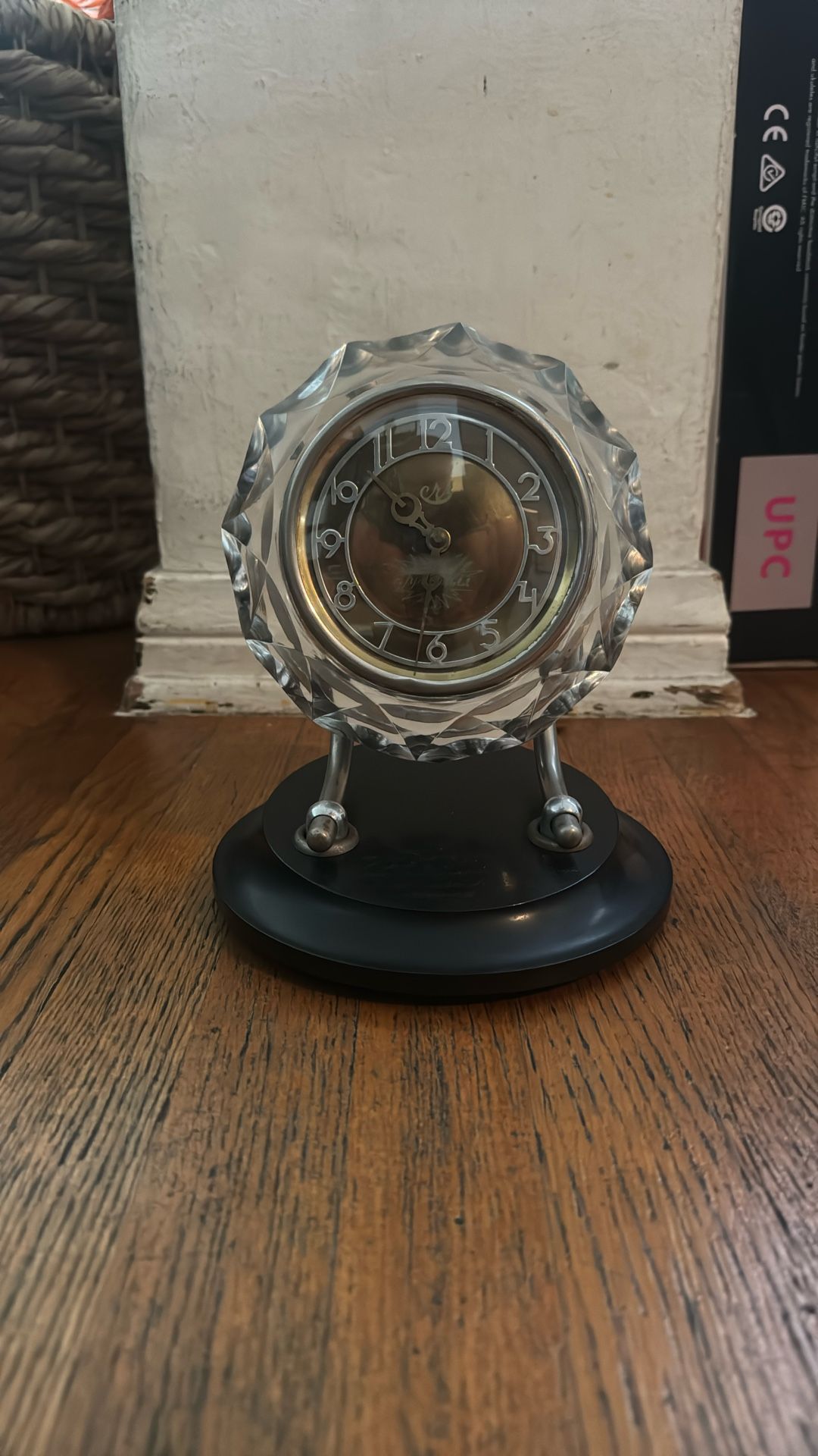 This is a vintage Soviet Majak mechanical table clock with an Art Deco cut crystal case and a black base. Made in the USSR, likely from the 1960s or