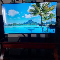 55 Inch LG 4uk TV With Three Tier Black Glass Stand