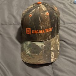 camouflage Lincoln Tech promotional cap is a Nissin brand hat featuring an adjustable strapback closure