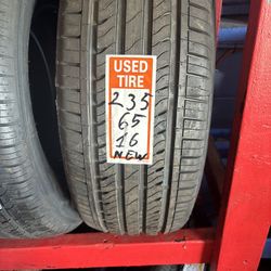 NEW TIRE 235-65-16