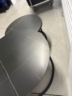 Two black with gold streak coffee tables