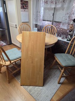 Solid oak 45" round dinette set with 18"  roll out extension