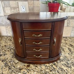 Wooden Jewelry Box with a walnut finish and an oval design