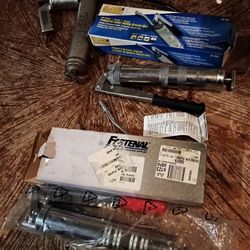 1 Pneumatic Grease Gun & 2 Manual Grease Guns, $25 Each