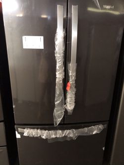 New scratch and dent whirlpool black and stainless steel French door fridge. 1 year warranty