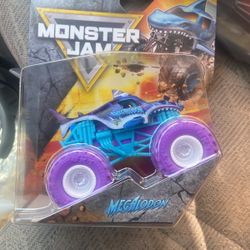 2026 MONSTER JAM SERIES MONSTER TRUCK - GALAXY BODY PURPLE TIRES MEGALODON 1:64