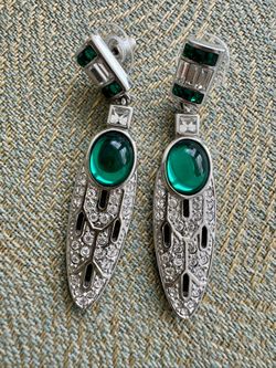 Vintage, circa unknown, designed earrings signed and designed by V&A Museum Shops. Featuring faux green cabochons accented both green and white crysta